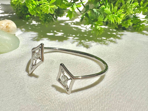 Silver bracelet with labgrown diamonds on a light fabric background, stella collection