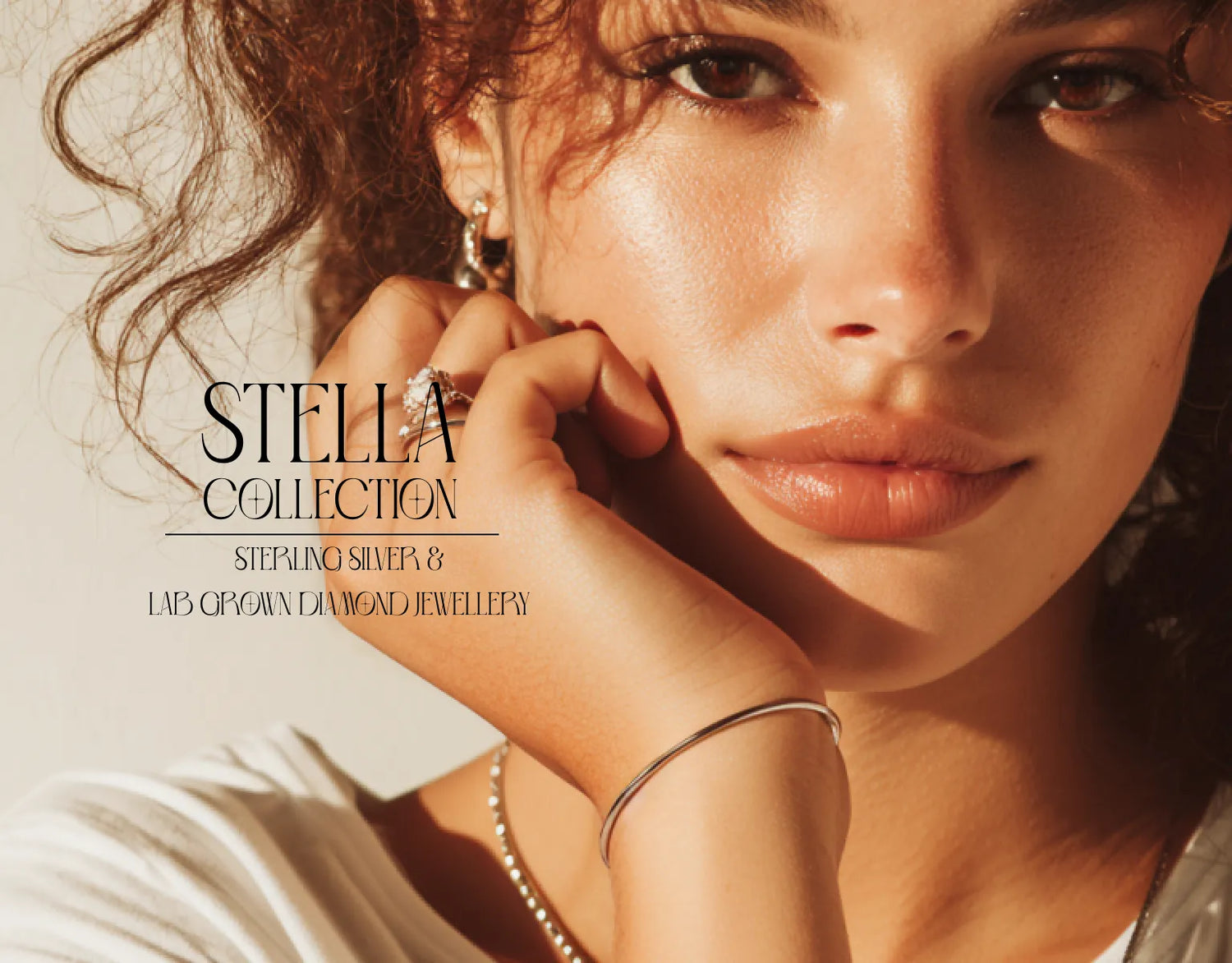 Close-up of a woman wearing jewelry with 'Stella Collection' text overlay.